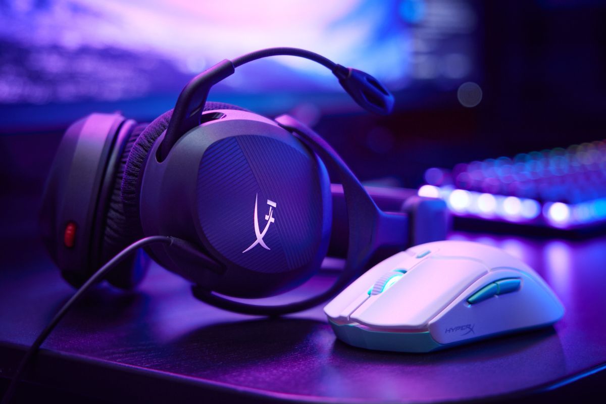 Pulsefire haste 2 core in white on a desk with HyperX gaming headset and monitor